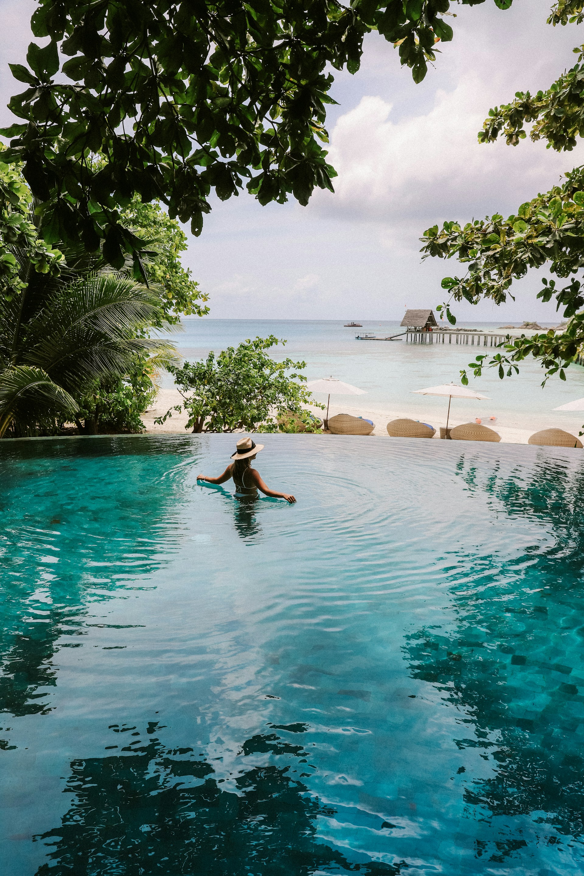 Woman in a tropical pool